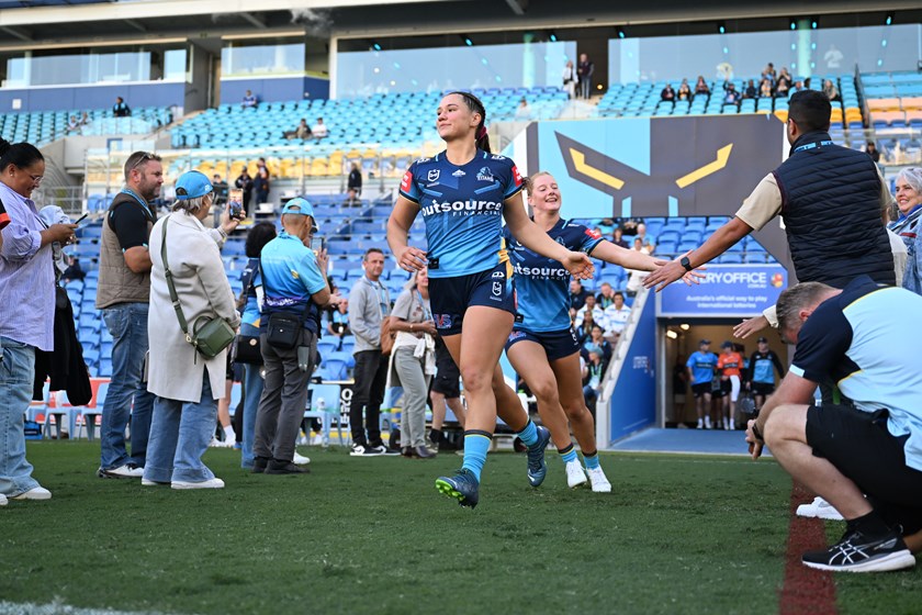 Megan Pakulis runs out for her first game of NRLW.