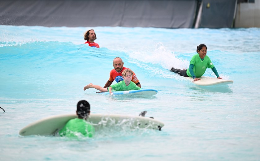 Surfing world champion Tom Carroll was on hand to help teach the students how to surf.