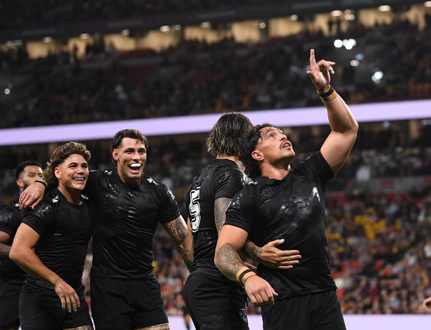 Kotoni Staggs points to the sky as he celebrates a try.