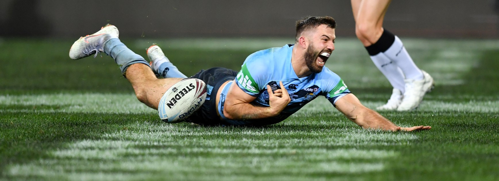 James Tedesco scores for the Blues.