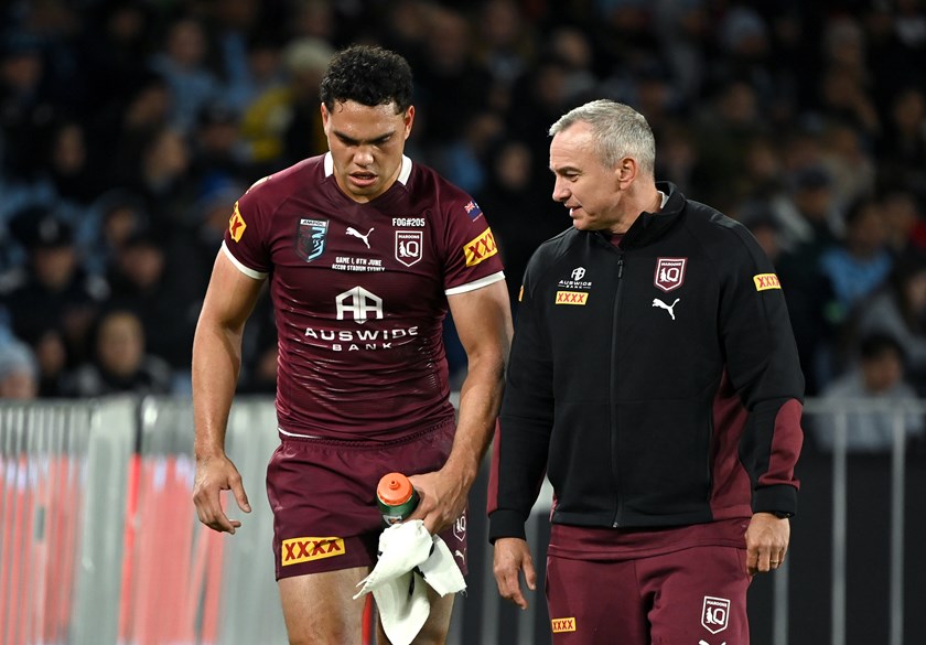 Xavier Coates is helped off with an ankle injury midway through the first half.