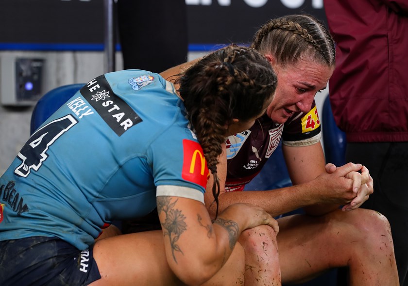 Blues captain Isabelle Kelly consoles her Maroons counterpart Ali Brigginshaw after Origin II.